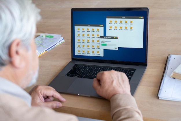 A person using a laptop to research salary and benefits data for their job role, with multiple tabs open showing different compensation websites.