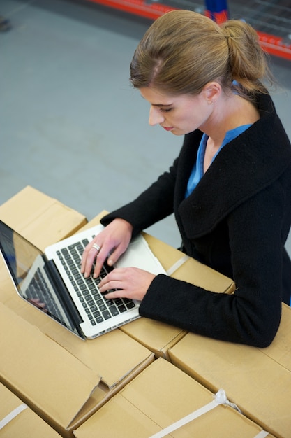 An employee using a digital platform on their laptop to customize their benefits package, showcasing the ease and flexibility of personalized benefits.
