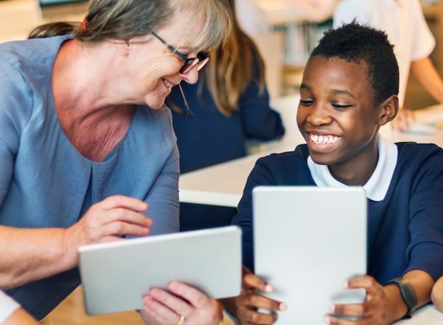 A teacher is providing individualized support to a student who is using assistive technology in a classroom. The teacher is smiling and encouraging, and the student appears confident and engaged. The scene highlights the importance of personalized learning and support for students with diverse needs.