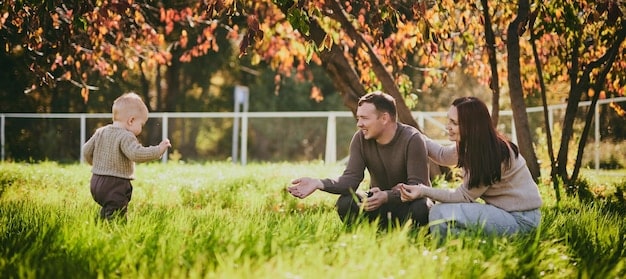 A family enjoying time together in a park, symbolizing the benefits of paid family leave and work-life balance initiatives.