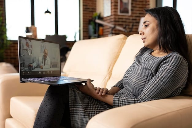 A person sitting in a comfortable chair, talking to a therapist via a video call on a laptop, representing the accessibility of telehealth mental health services.